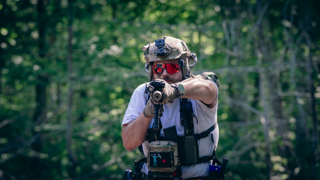 a-man-wearing-a-mask-and-holding-a-gun-ytcmg92von8